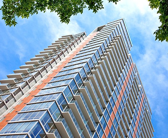 Exterior photograph of Burnham Pointe, a 28-story, 298-unit rental building in Chicago’s Printers Row neighborhood.