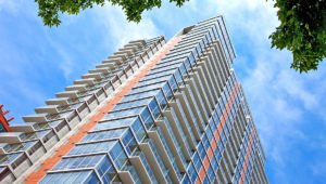 Exterior photograph of Burnham Pointe, a 28-story, 298-unit rental building in Chicago’s Printers Row neighborhood.