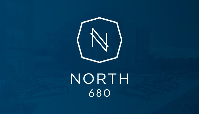 The North 680 logo presented on a blue background. The logo feature a stylized "N" in side a flattened octagon with North 680 written below it.
