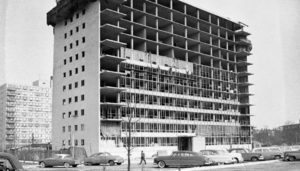 A historic image of one of the Lake Meadows towers being constructed in the 1950s. The structure is built, but no exterior walls or windows have been installed.