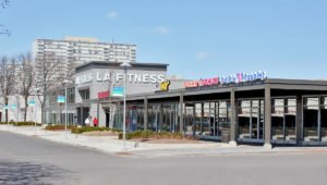 A view of LA Fitness, Subway, Dunkin' Donuts and Baskin Robbins at Lake Meadows Market. Lake Meadows apartments are seen in the background.