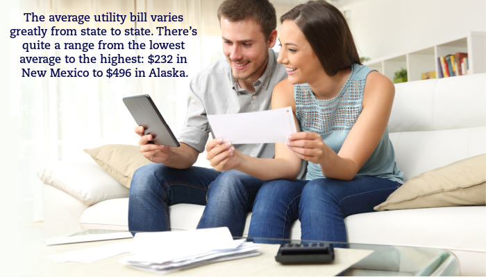 A couple sits on their couch and reviews their utility bills. A caption reads "The average utility bill varies greatly from state to state. There’s quite a range from the lowest average to the highest: $232 in New Mexico to $496 in Alaska."
