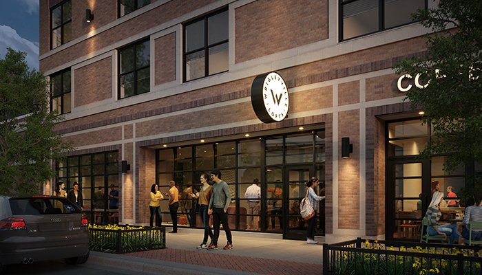 A rendering of the new development looking at the front entrance to the building. It is evening and people are gathered out front.