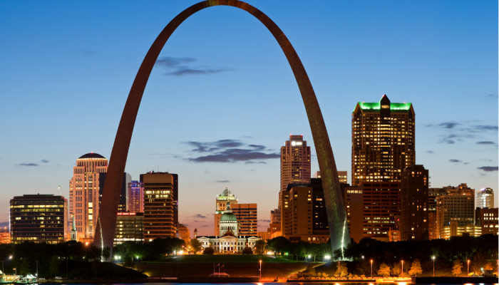 An evening view of St. Louis with the Gateway Arch front and center.