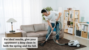 A man wearing headphones vacuums his living room. A caption reads, "For ideal results, give your apartment a deep clean in both spring and the fall."