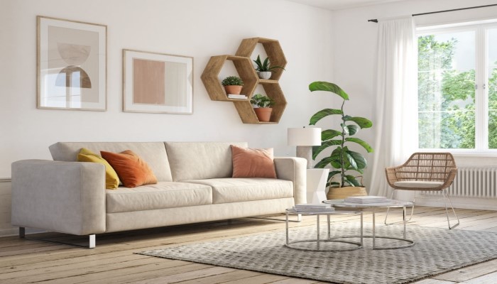 A living room interior with beige colored furniture and wooden elements.