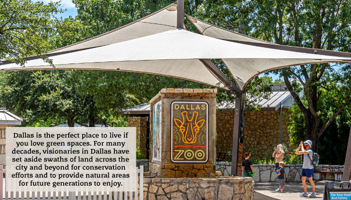 A sign of the Dallas zoo. A quote reads: "Dallas is the perfect place to live if you love green spaces. For many decades, visionaries in Dallas have set aside swaths of land across the city and beyond for conservation efforts and to provide natural areas for future generations to enjoy."