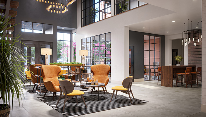 A rendering of the lobby at Moda at The Hill. Several lounge chairs sit in the center with office spaces off to the right.