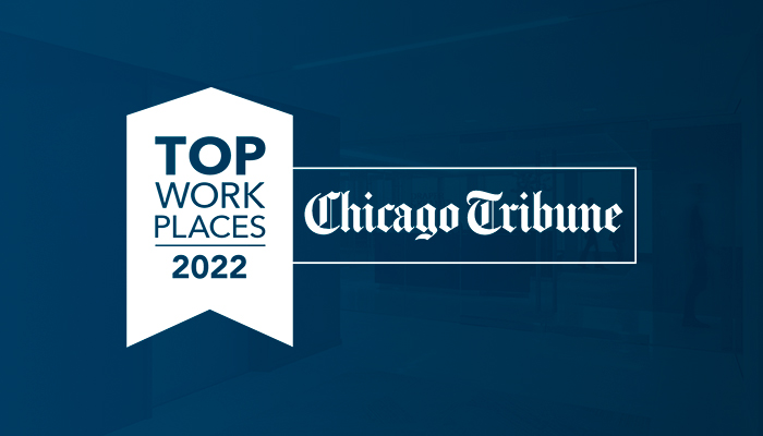 The Chicago Tribune 2022 Top Work Places medallion in white on a blue background.