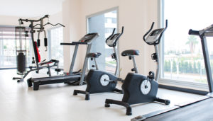 Looking across a line of exercise equipment in a fitness center.