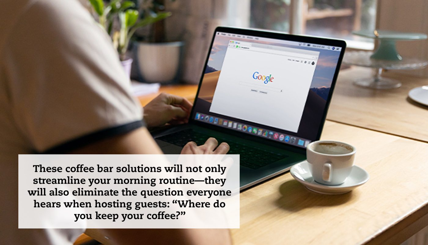 A close-up of a laptop sitting on a coffee table with someone doing an internet search. A cup of coffee sits next to the laptop. A quote reads: "These coffee bar solutions will not only streamline your morning routine—they will also eliminate the question everyone hears when hosting guests: 'Where do you keep your coffee?'”