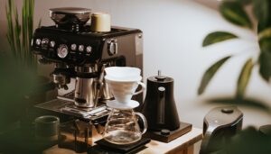 A small coffee station setup in the corner of a living room.