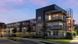 A modern apartment building at dusk.