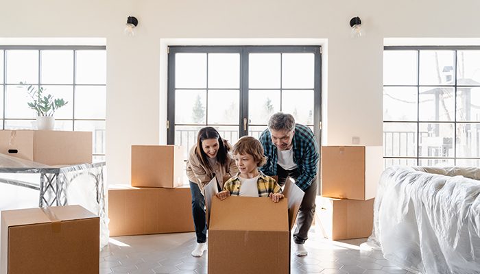 A family unpacking boxes in a new home.