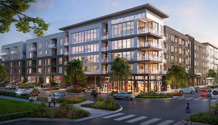 Exterior rendering of Tempo Nine Mile Station, a modern five-story rental community in Aurora, Colo., featuring large glass windows, balconies, landscaped walkways, and a vibrant streetscape with pedestrians and vehicles.